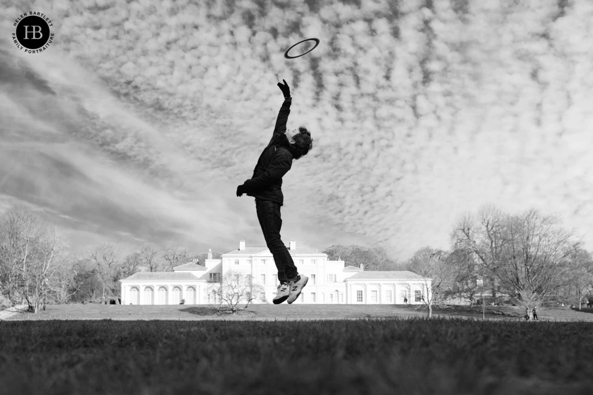 boy jumps to catch frisbee demonstrating storytelling with a canon RF 35mm lens