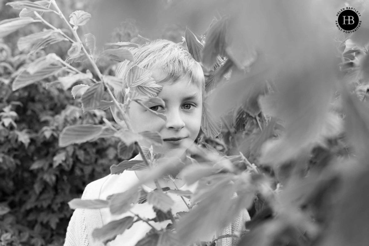 close up portrait taken through foliage with canon RF 50mm lens
