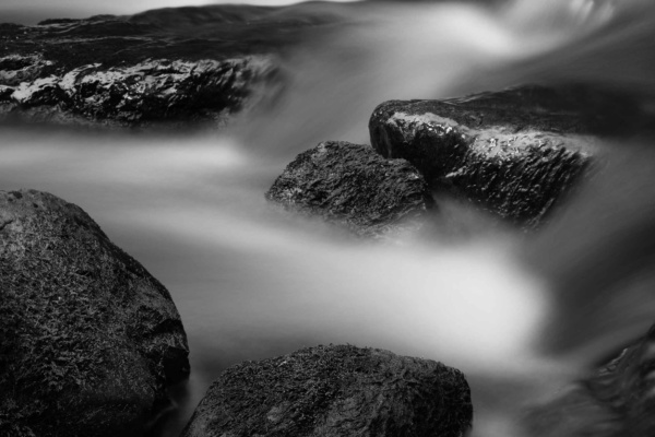 Slow shutter speed stream photo in black and white taken with a Canon tilt-shift lens.