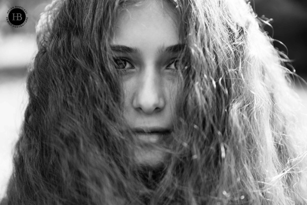 teenager portrait with amazing hair and striking eyes