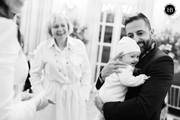 baby-cuddles-at-london-christening