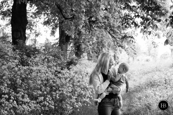 Mother and baby portrait taken on Ealing Common W5. Black and white photo.
