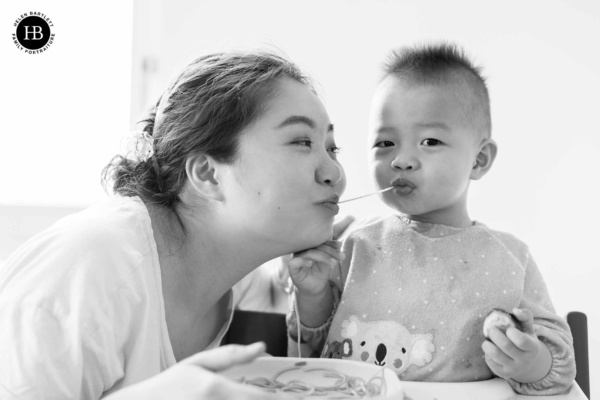 mother-son-share-spaghetti-family-photography-harrow