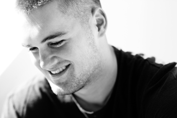 Black and white headshot of teenager.