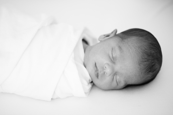 Black and white sleeping newborn photograph.