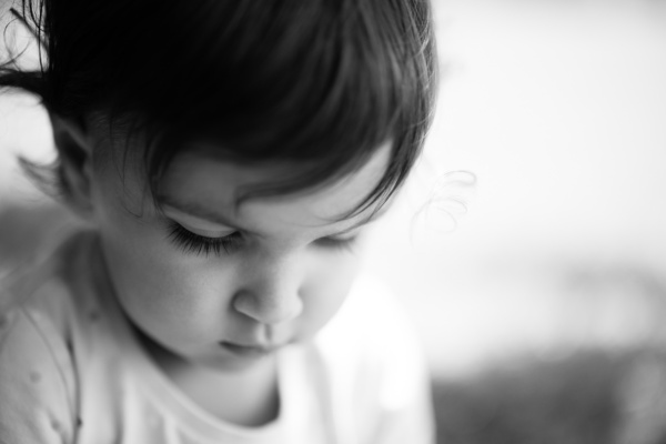 A child has a quiet moment.