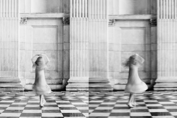 A girl spins around outside St Paul's Cathedral as part of a London shoot.