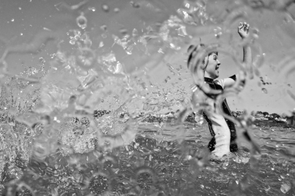 A child splashes in the water.