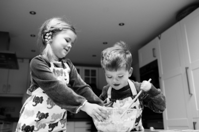 A brother and sister bake together.