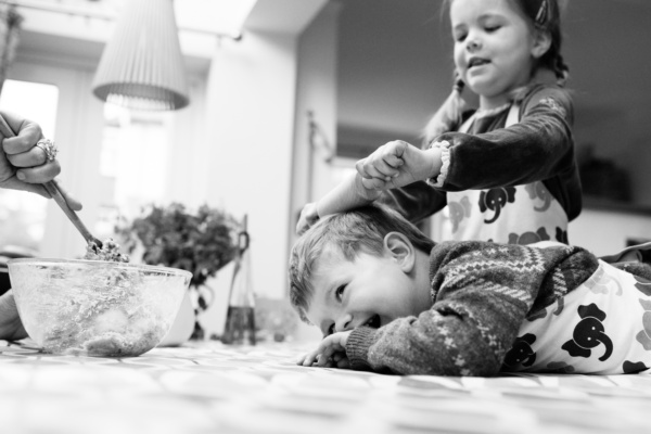 Two children bake together.