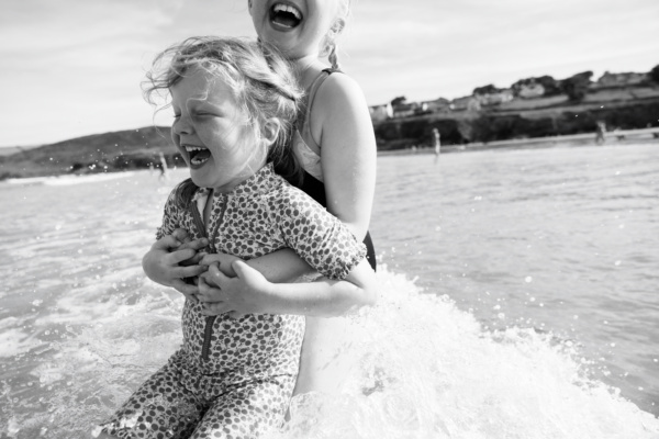 Children play in the sea together.