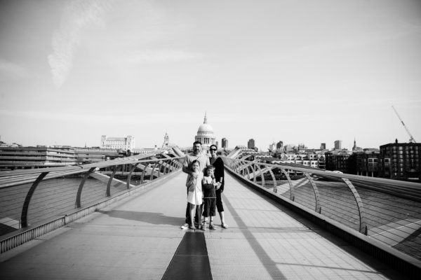 Family on the Millennium Bridge London, with St Paul's Cathedral in the background.