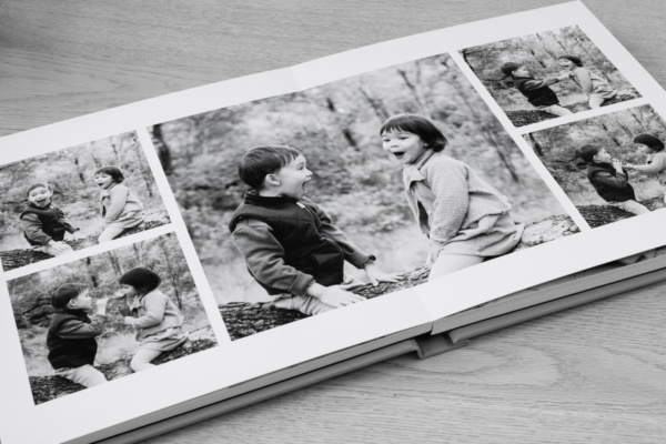 Family photo album showing a double page spread of children's photos.