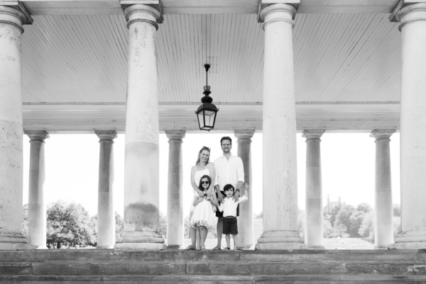 A family portrait near columns in Greenwich, London.