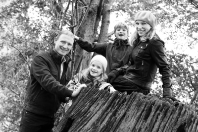 A family portrait on a fallen tree.