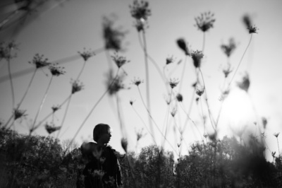 A child in a field of flowers.