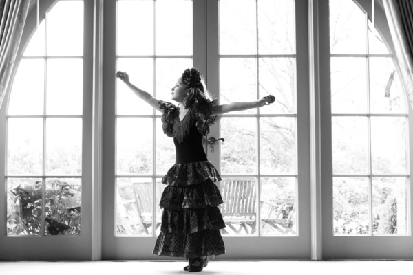 Girl dances in a flamenco dress.