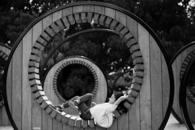 A girl lays inside a wooden circle during a London portrait session.