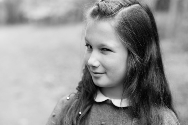 A girl winks at the camera.