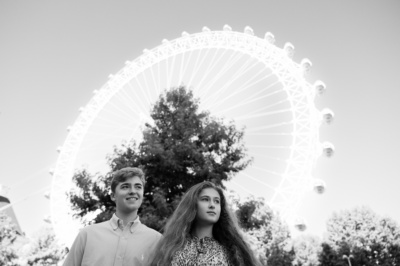 Siblings in front of London Eye.