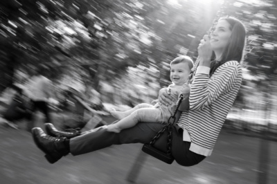 A mother and baby portrait as they swing together.