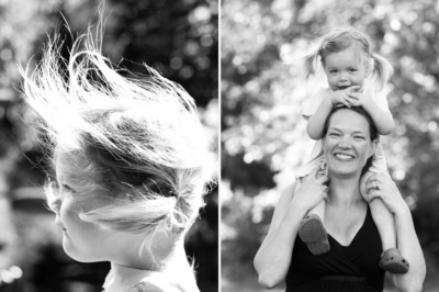 A mother carries her daughter on her shoulders.