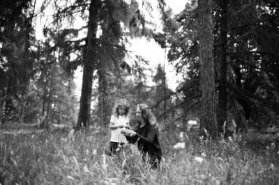 A mother and her daughter in flowering grasses during a London portrait shoot.