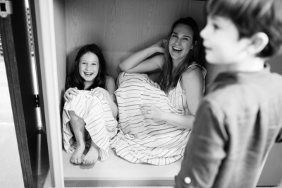 A mother and daughter laugh together.