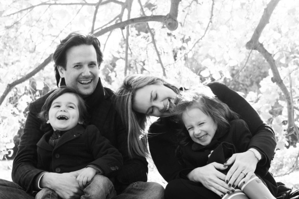 Portraits of parents and their two children in a London park.