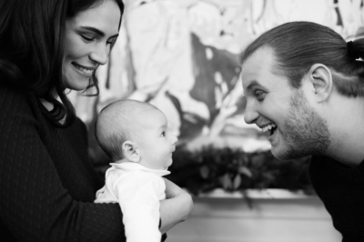 Parents make their baby laugh.