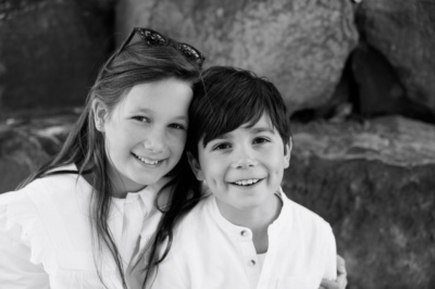 Sibling portrait in black and white.