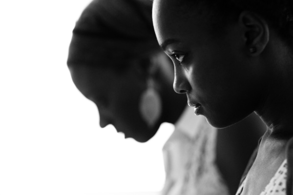 Sibling portrait with high contrast.