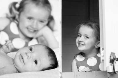 Siblings in a family shoot in black and white.