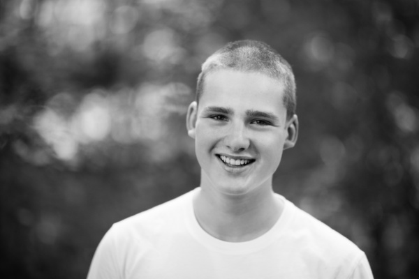 Teen's outdoor portrait against a blurred background.