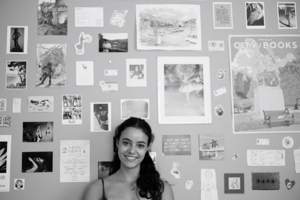 A teenage daughter photographed against memorabilia.