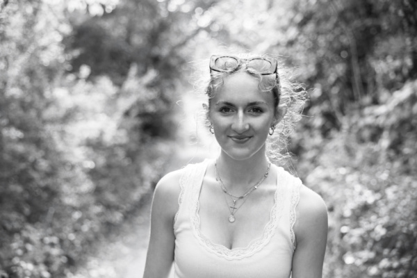 A teenage portrait on a forest path.