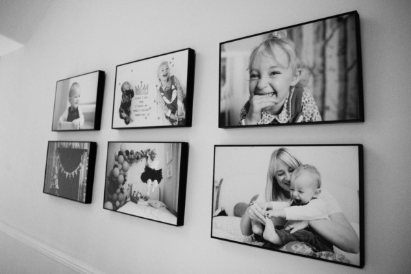 A tray frame collection of family photos.