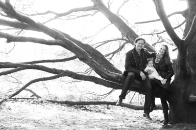 West London family portrait posed in a tree.