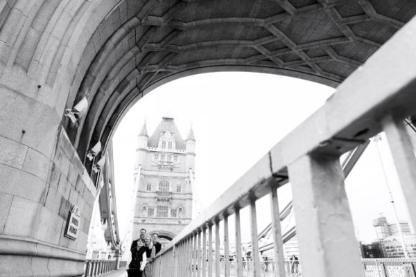 Family stand on tower bridge for family photo