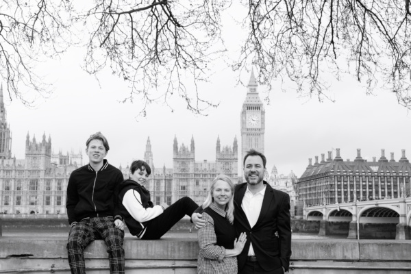 family pose with Big Ben and Houses of Parliament in the background