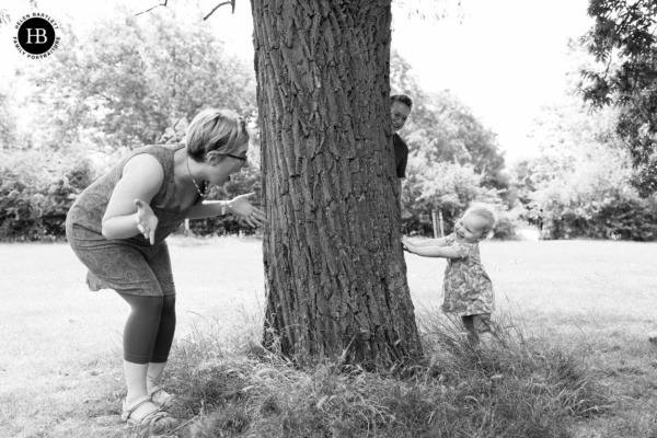 family-plays-hide-and-seek-on-photo-shoot