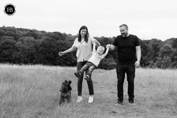 family-swing-toddler-son-on-family-photo-shoot