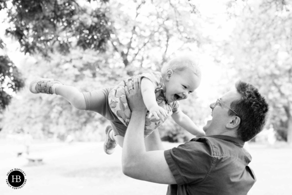 father-swings-toddler-in-air-family-photography-session-brockley