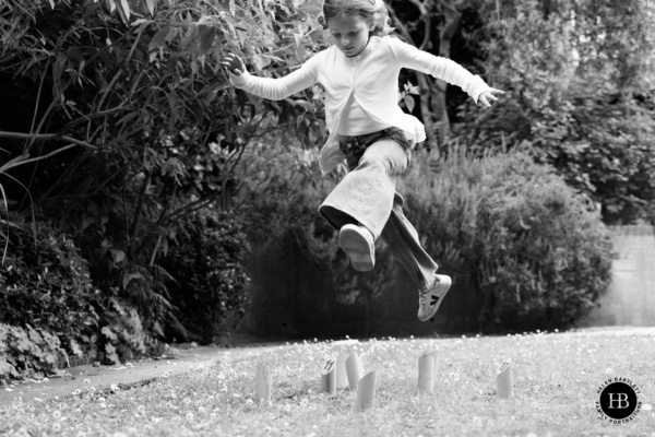 girl-leaps-over-garden-game-highgate-family-photo-shoot