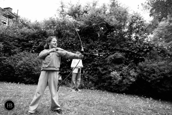 little-girl-practices-archery-garden