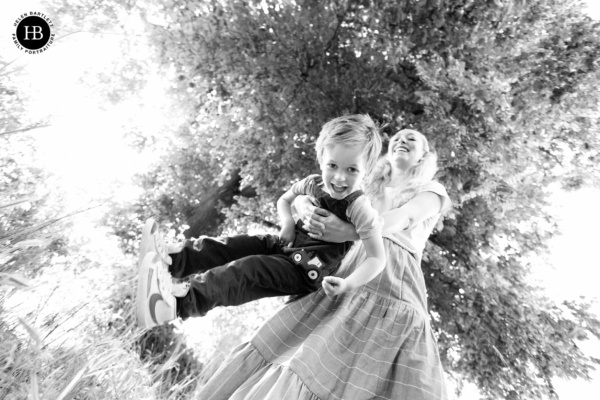 mother-swings-toddler-canon-16mm-lens