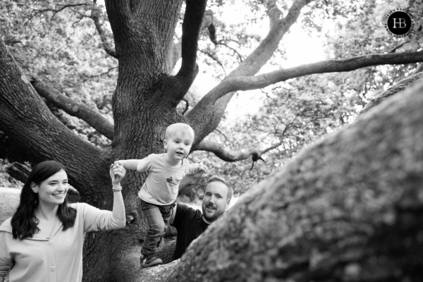 parents-help-little-boy-climb-tree-hampstead