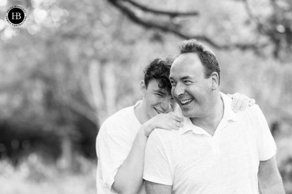 father-and-teenage-son-laugh-together