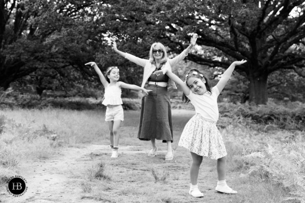 girls-and-grandmother-play-during-family-photo-shoot-west-london