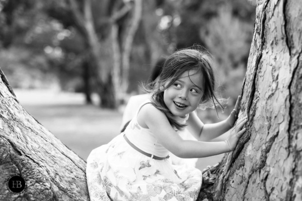 laughing-girl-sits-in-tree